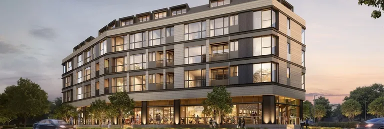 Artisan 8, artist&rsquo;s impression: the long front elevation at dusk, three residential storeys and the attic penthouses above a row of glazed first-storey shopfronts behind roadside trees